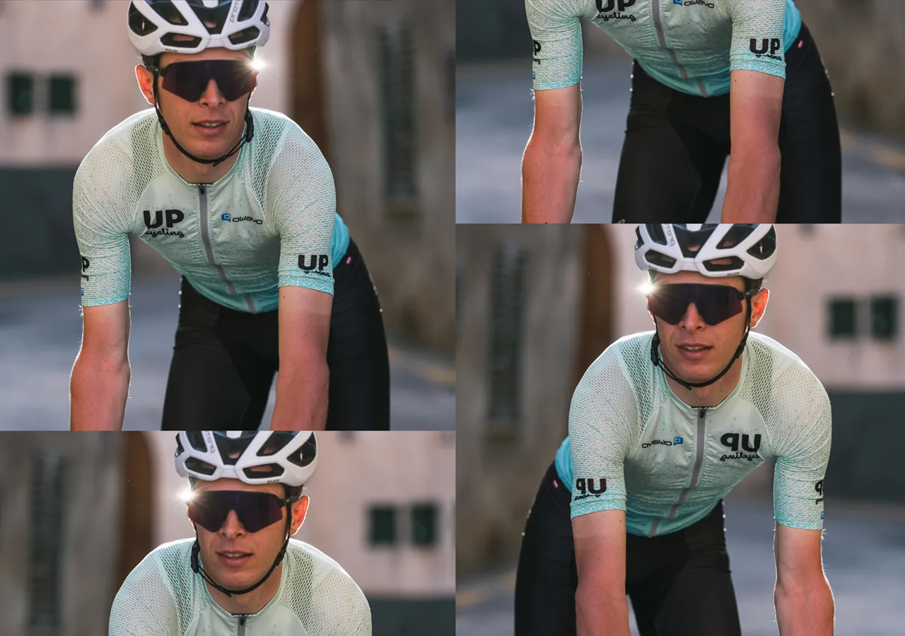 Un cycliste portant un maillot bleu clair à motifs avec le logo 'UP cycling' et le nom de marque 'owayo' sur la poitrine, en train de faire du vélo.